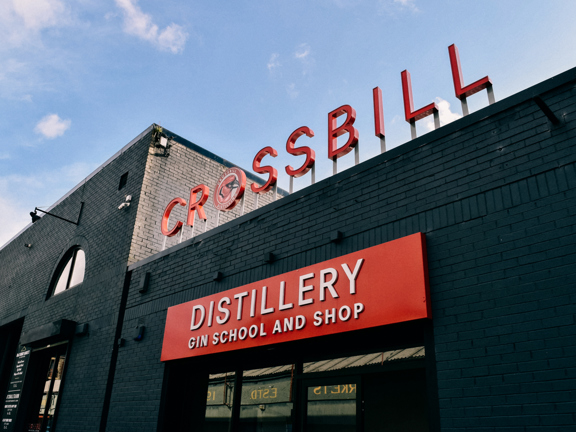 External view of distillery with Crossbill Distillery Gin School and Shop sign