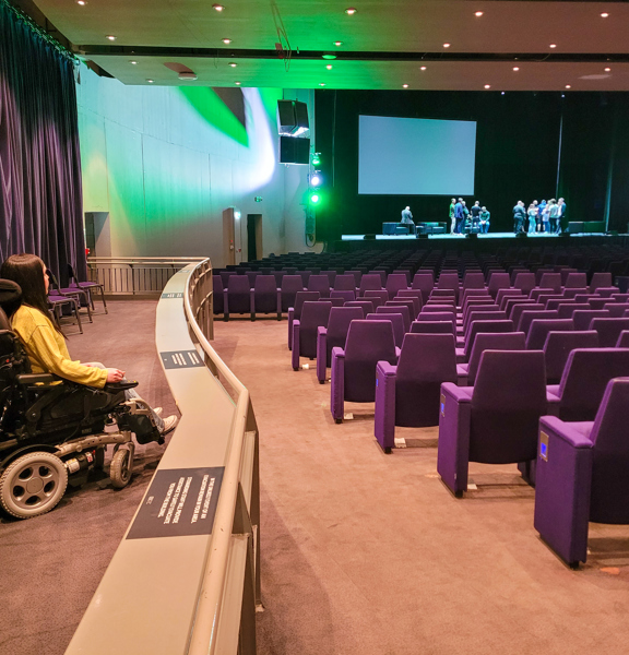 Wheelchair user in an auditorium at the Scottish Event Campus