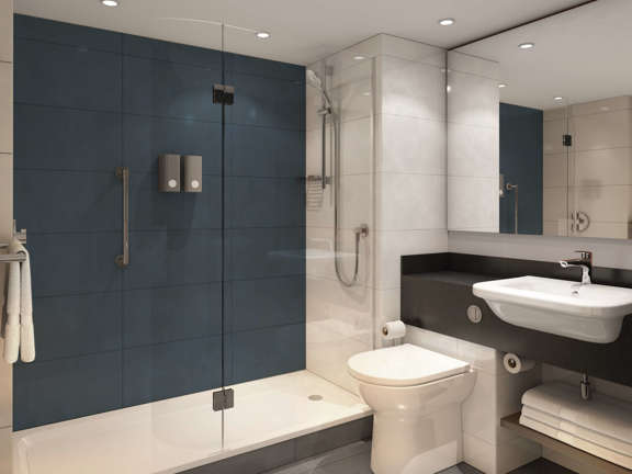 White shower room with grey floor and accent blue wall in shower area