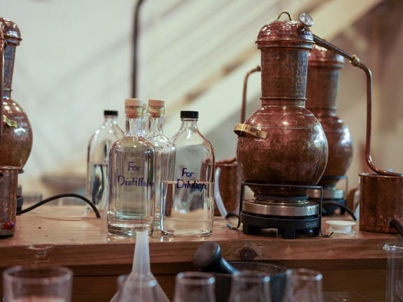 Distilling bottles and equipment laid on a table