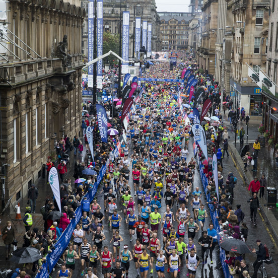 A crowd of runners leave from the George Square start line at the Great Scottish Run.
